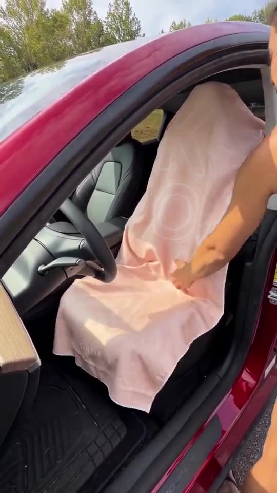 Peach KOVA towel going on a car seat