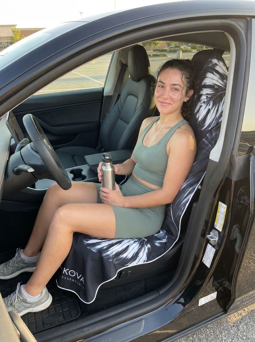 Woman after a workout on the Black KOVA towel
